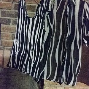 2pcs blk and white cami and top  Has sm.tear.